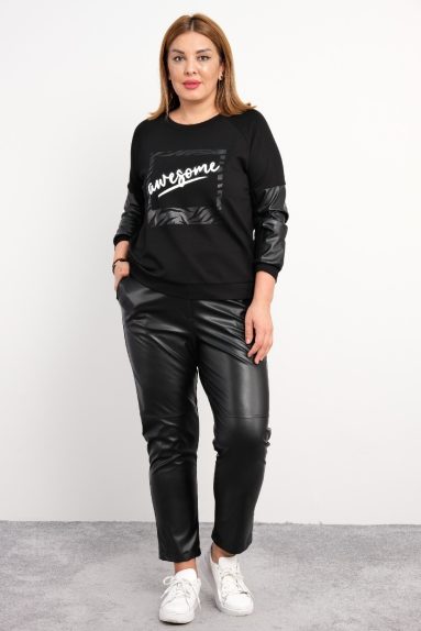  This plus-size womens two-piece set comes in black and showcases elegance and comfort with both front and back views. The product is made of 95% cotton and 5% lycra, giving it softness and elasticity. The top features a sporty and modern 